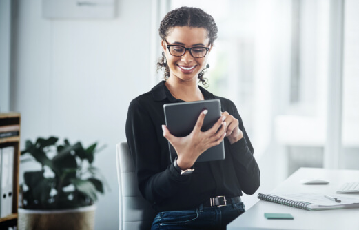 woman looking at a tablet device